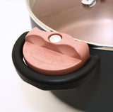 Image of the copper colored locking mechanism on the side of the Gotham Lock Lid Pot in the unlocked position.
