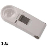 White, round lens hand held magnifier with grey on/off switch on rectangular handle labeled 10x.
