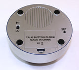 Back of the talking one tap clock showing the speaker, battery compartment, set button and volume control switch. 