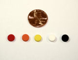 5 individual round, flat, foam bump dots in assorted colors next to a penny. Each bump dot is about 1/6 the size of a penny.