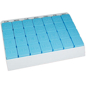 pill organizer consisting of seven opaque, blue, removable pill holders in a white tray. Each pill holder has Braille and raised letters denoting Morn, Noon, Eve, Bed. and features the day of the week labeled in large black print above each.