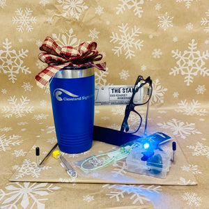 Reader's Bundle- Blue CSC Tumbler, bookstand, repair kit, cilp on lights, eyeglass chain, and readers featured against a snowflake background
