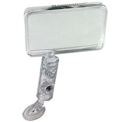 Magnifier with rectangular lens and cylindrical handle that attaches to a sewing machine on a white background.