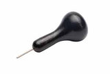 Black, rounded top wooden braille stylus on white background.